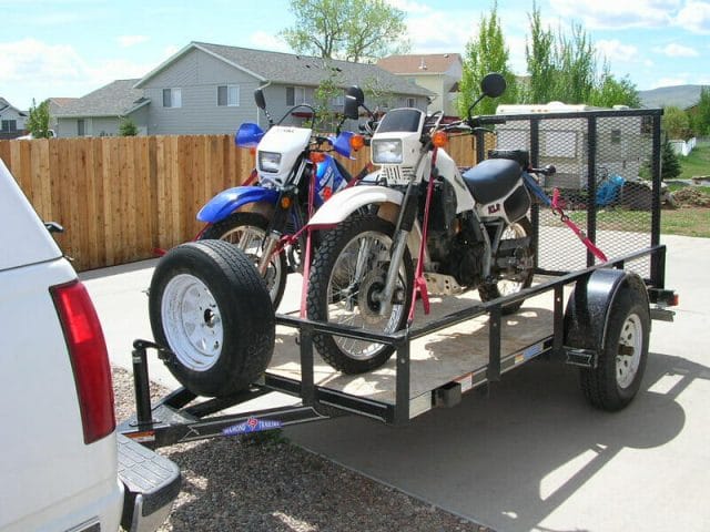 How do you tie down two motorcycles on a trailer?