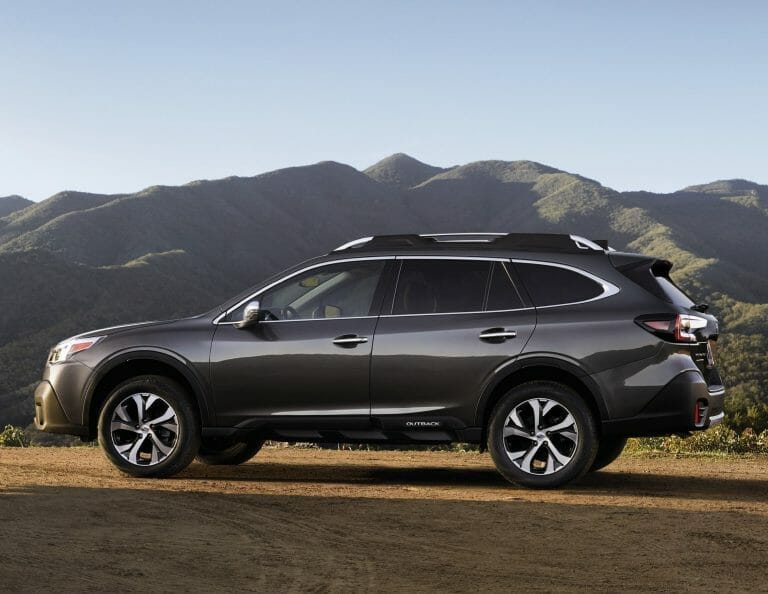 The 2019 Subaru Outback, an ideal car for transporting dogs, is parked on a dirt road.